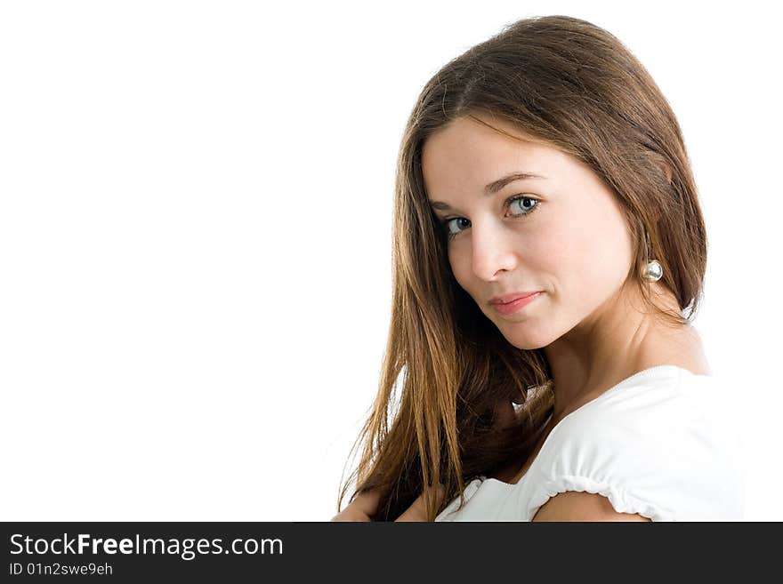 A beautiful young smiling woman with long brown hair posing on a white background