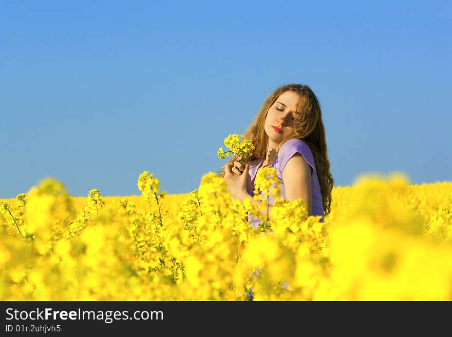 Woman in rape(canola) field. Woman in rape(canola) field