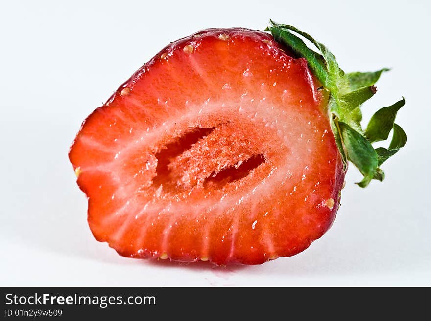 A single strawberry fruit isolated on a plain white background