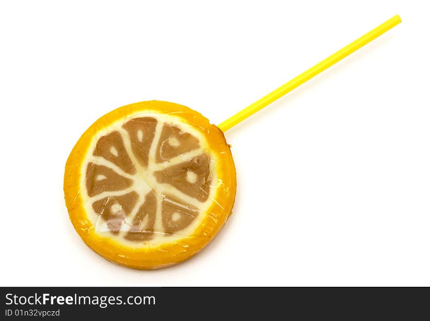 Sugar candies on  stick in the form of fruit on  white background. Sugar candies on  stick in the form of fruit on  white background