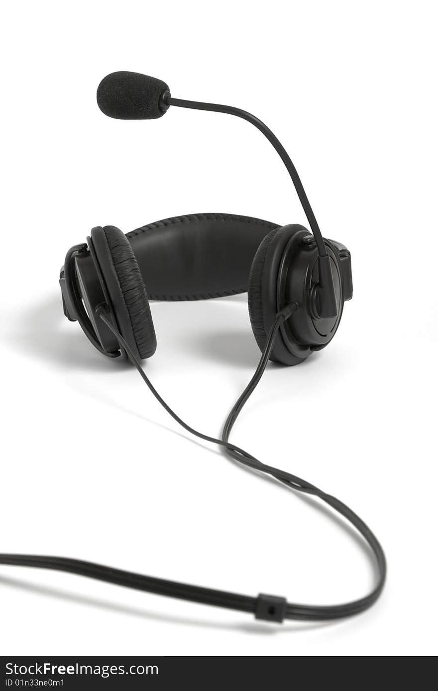 Black headphone with microphone on white background