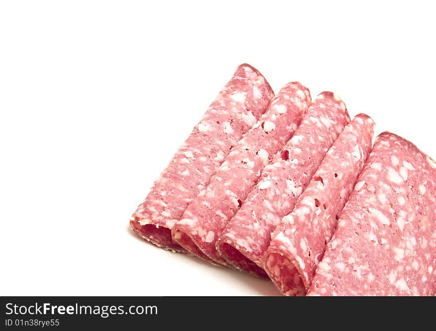 Slices of salami photography studio with white background