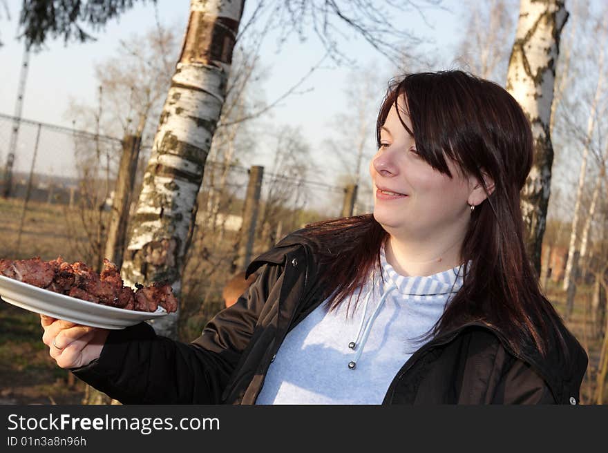 Girl holding shashlik