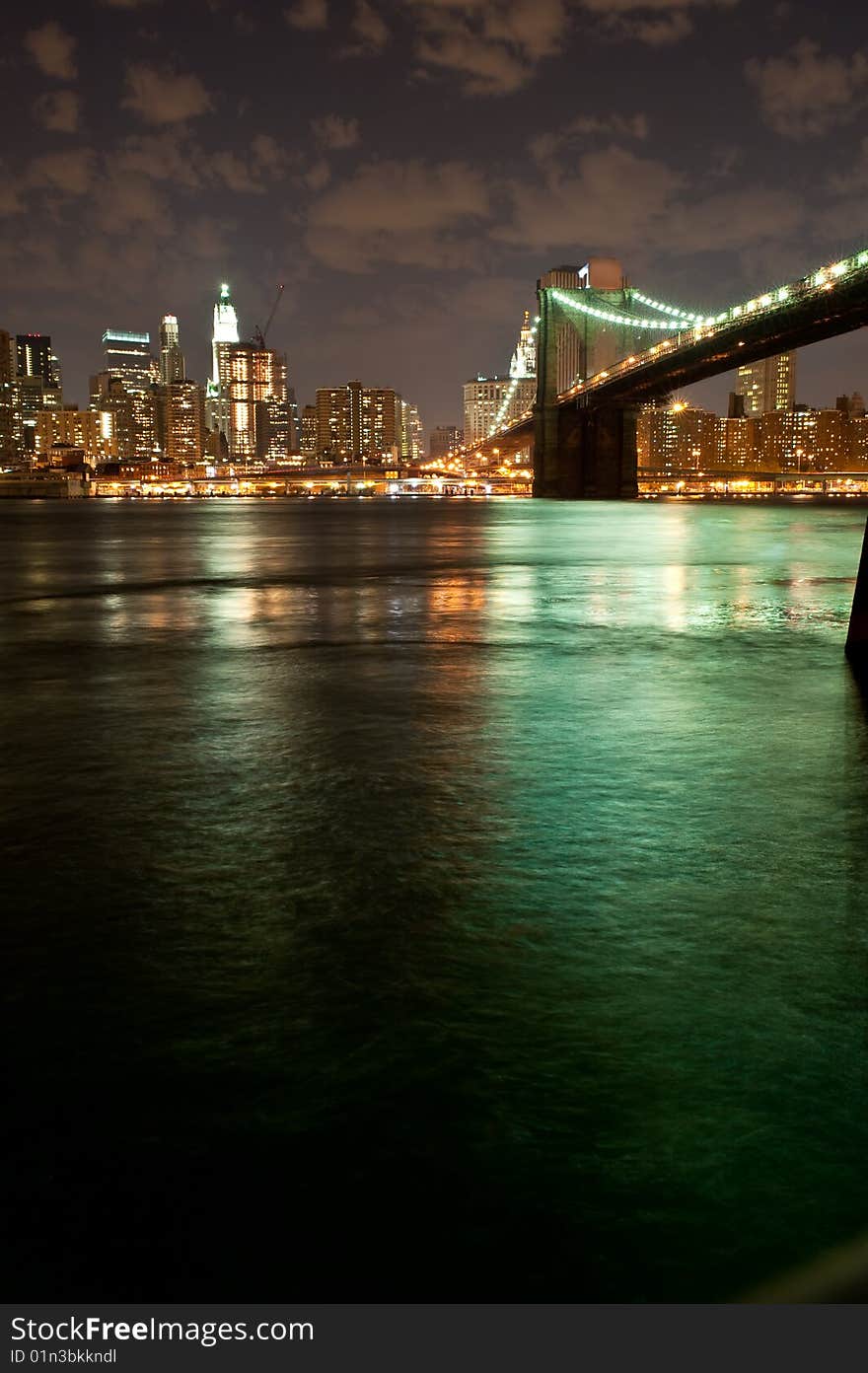 View of the Brooklyn Bridge in late evening. View of the Brooklyn Bridge in late evening.