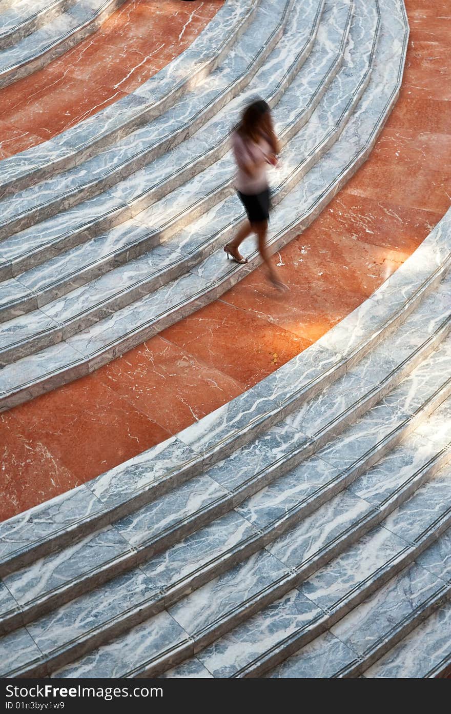 Person Walking Down A Stairway