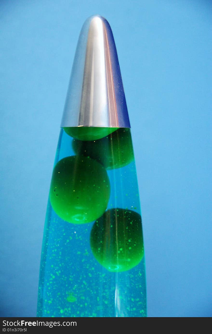 Blue lava lamp with green bubbles