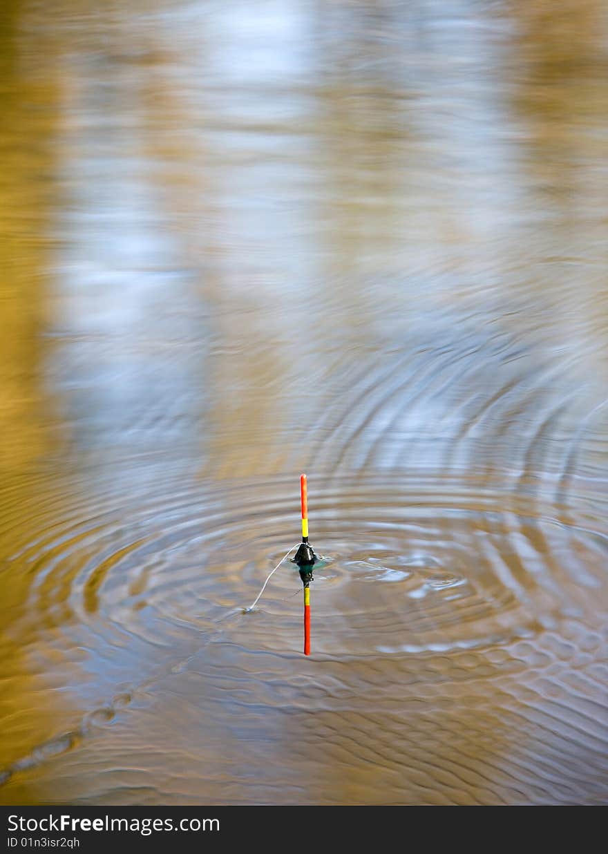 Bobber sign in lake waves