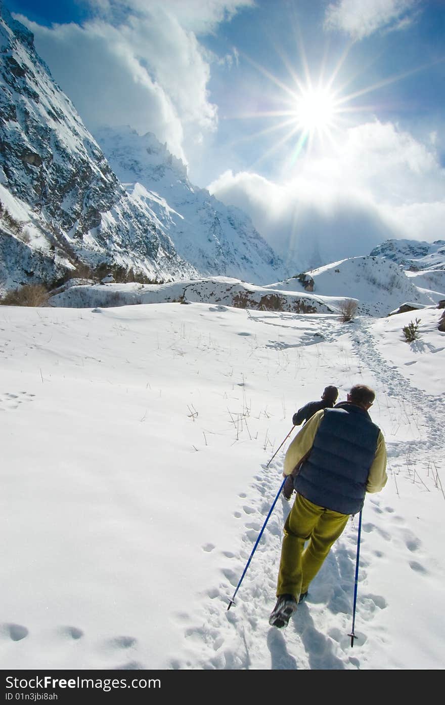 Hikers go up in mountains