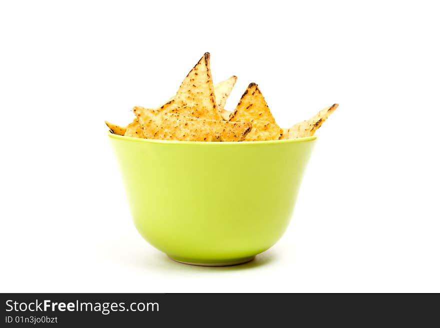 Tortilla chips in green bowl.