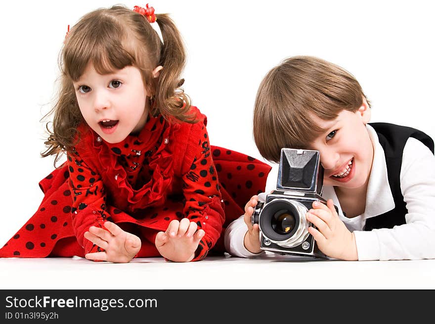 Adorable children taking pictures with photo camera. Adorable children taking pictures with photo camera