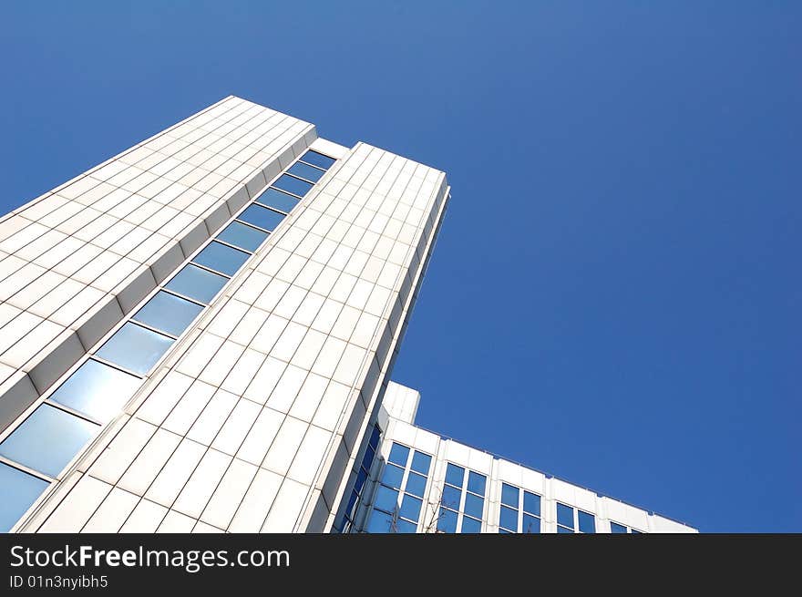 High white building and blue sky. High white building and blue sky