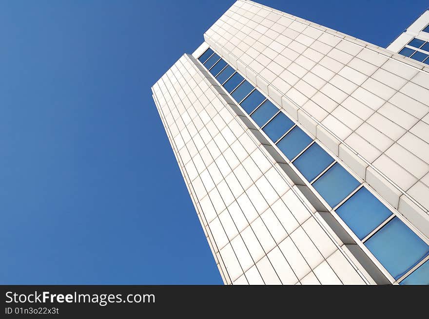 High white building and blue sky. High white building and blue sky