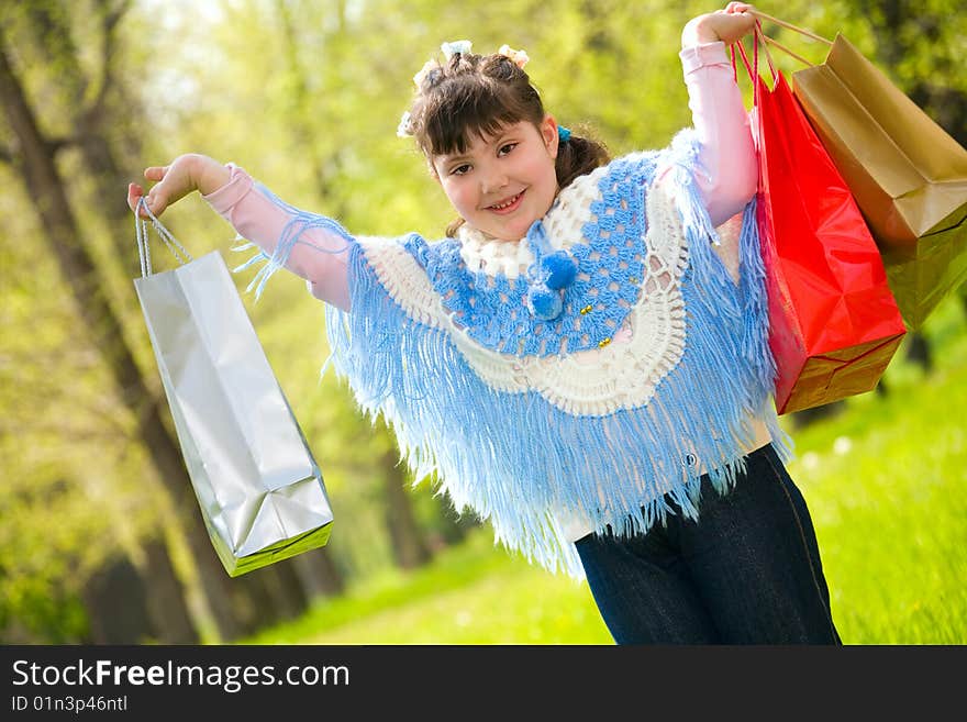 Little girl with shopping bags