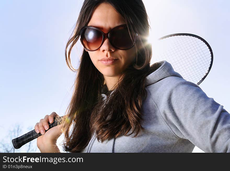 Young woman with badminton racquet