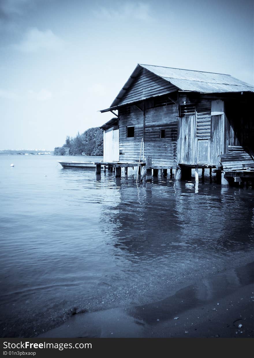 A old house on the waters in ubin island, in selenium tone