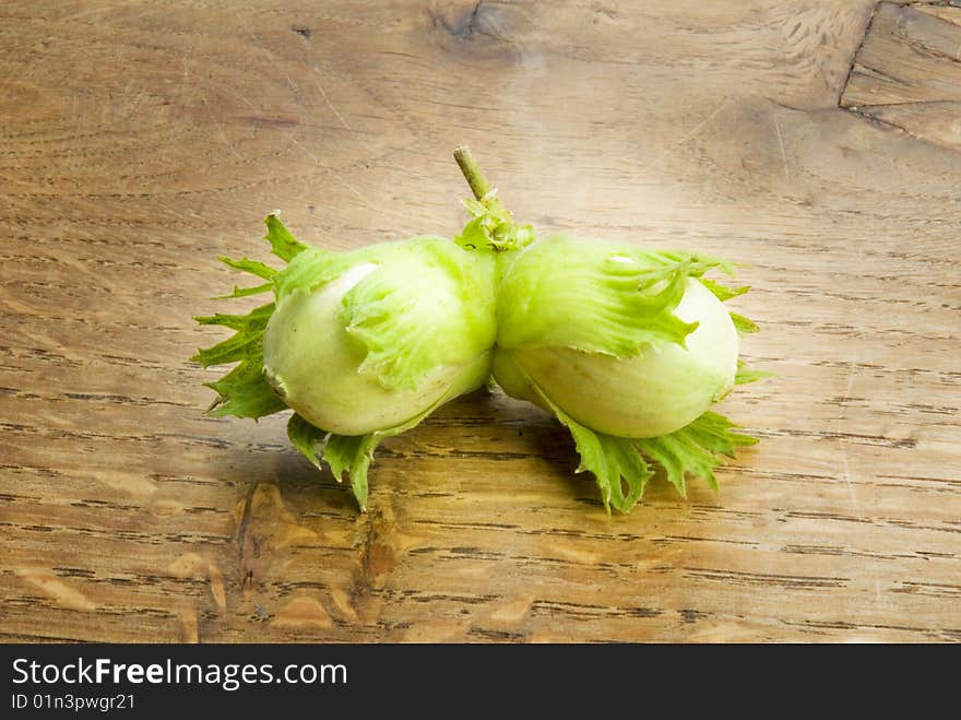 Pair of unripe hazelnuts