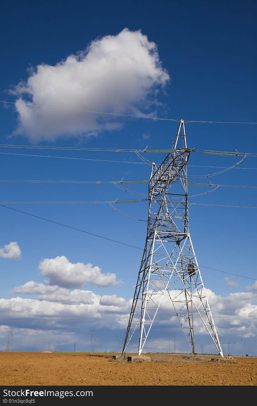 Electricity pylon against blue sky