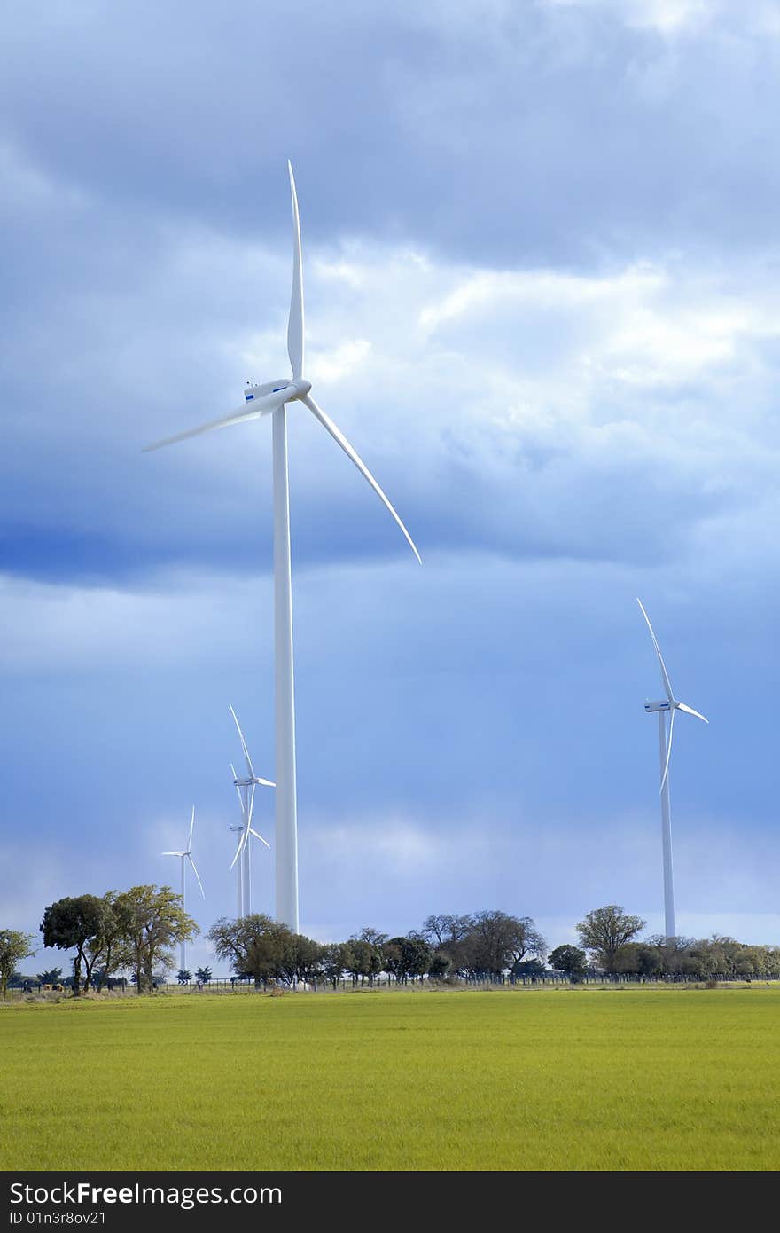 Windmills against a cloudy sky