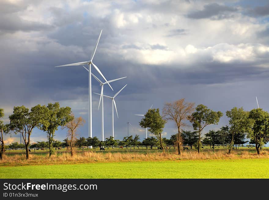 Windmills against a cloudy sky