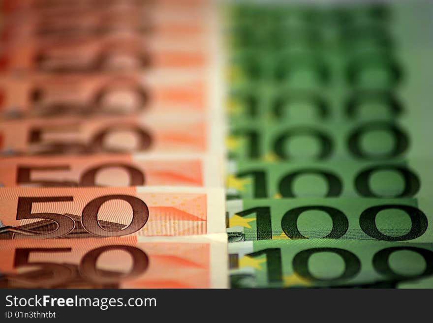 Rows of 100 and 50 Euro bills. Rows of 100 and 50 Euro bills