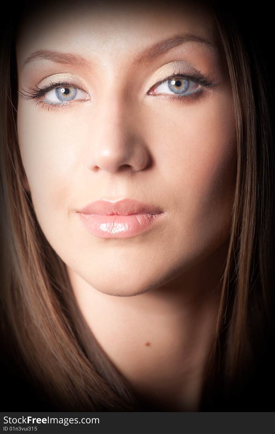 Portrait of attractive brown-haired girl. Strong vignetting on corners