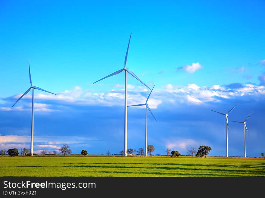 Windmills against a cloudy sky