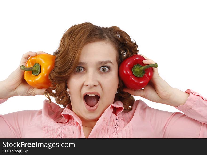 Pretty smiling woman holding sweet peppers. Beautiful young woman with fresh vegetables. Housewife with sweet peppers. Isolated over white background. Pretty smiling woman holding sweet peppers. Beautiful young woman with fresh vegetables. Housewife with sweet peppers. Isolated over white background.