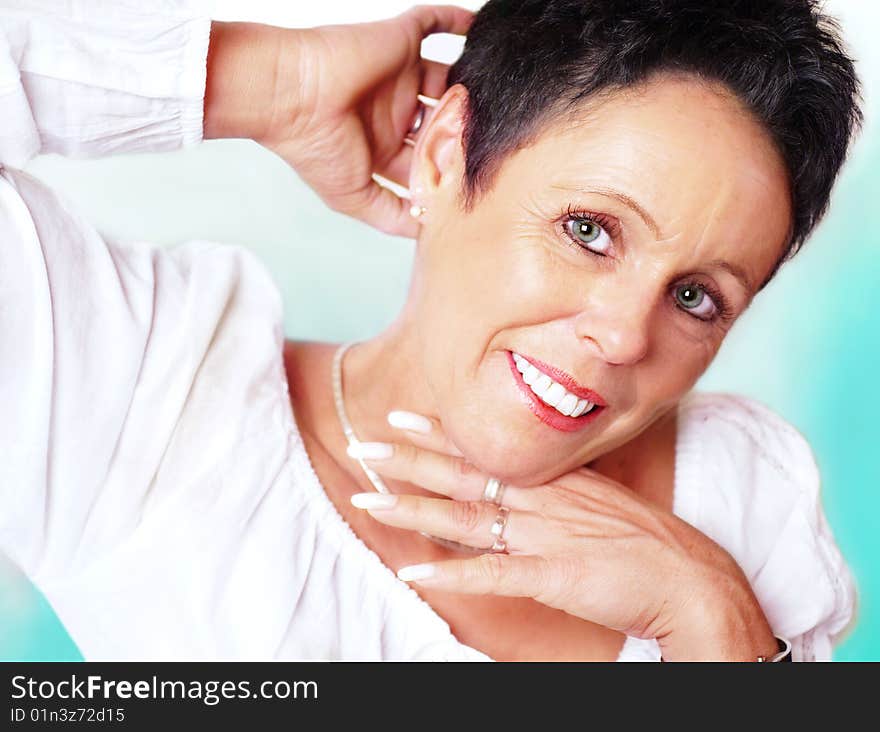 Mature woman portrait on mint background