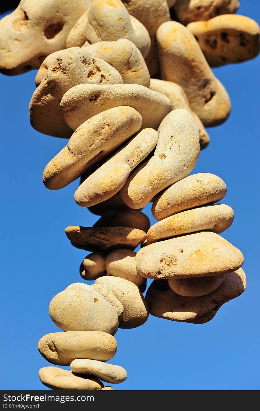 Accumulation of pebbles on the sea-sky background. Accumulation of pebbles on the sea-sky background