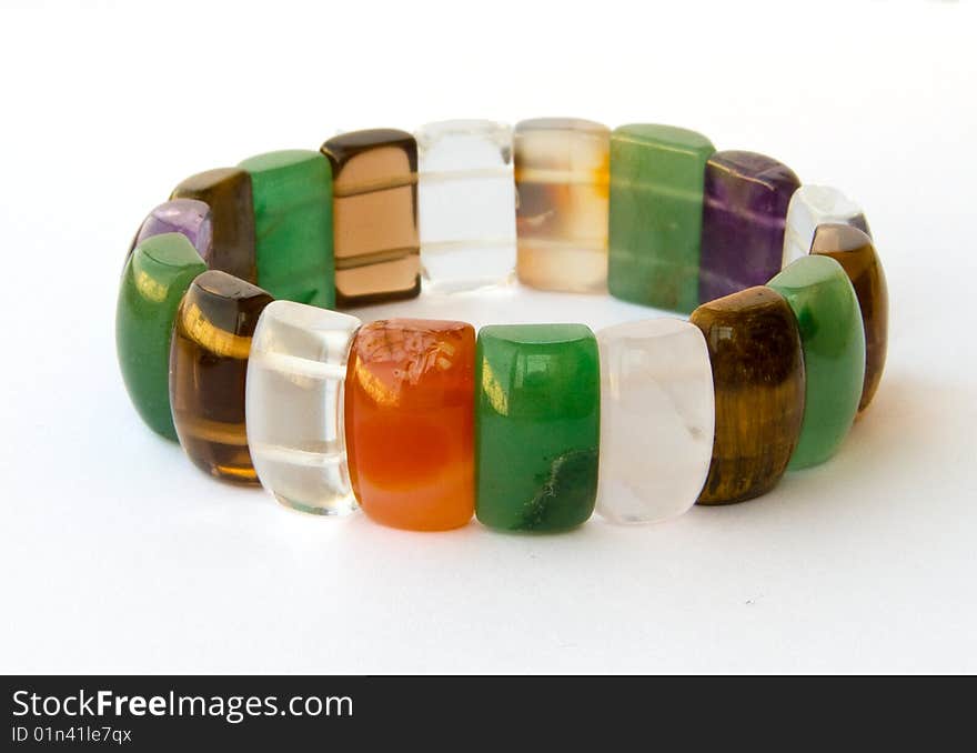 Multi-coloured bracelet on a white background