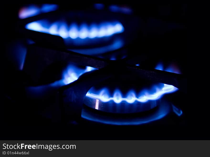 Blue flame of gas stove on black background. Blue flame of gas stove on black background