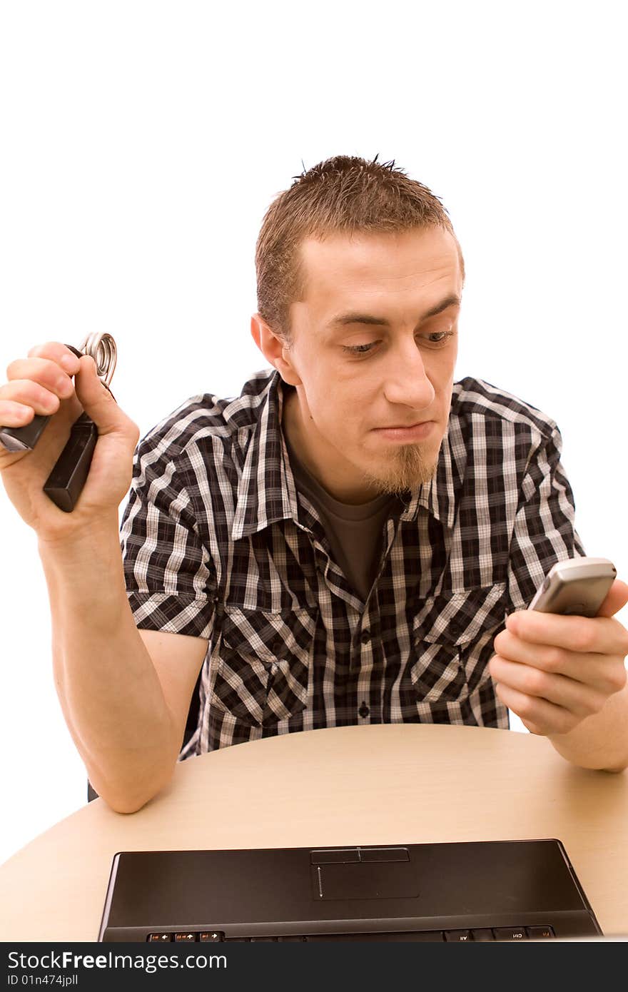 Man with phone working in office