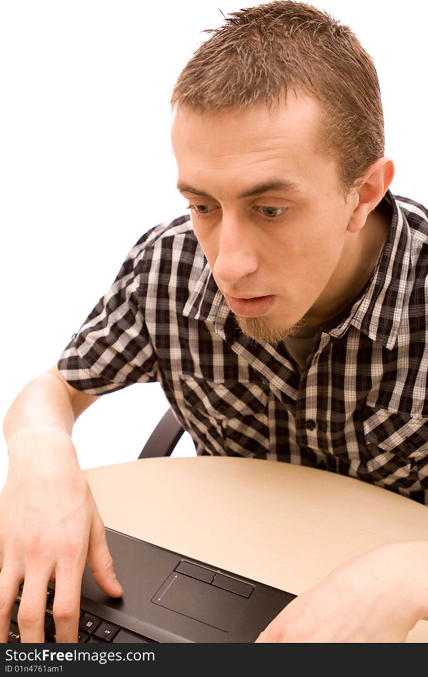 Man with phone working in office