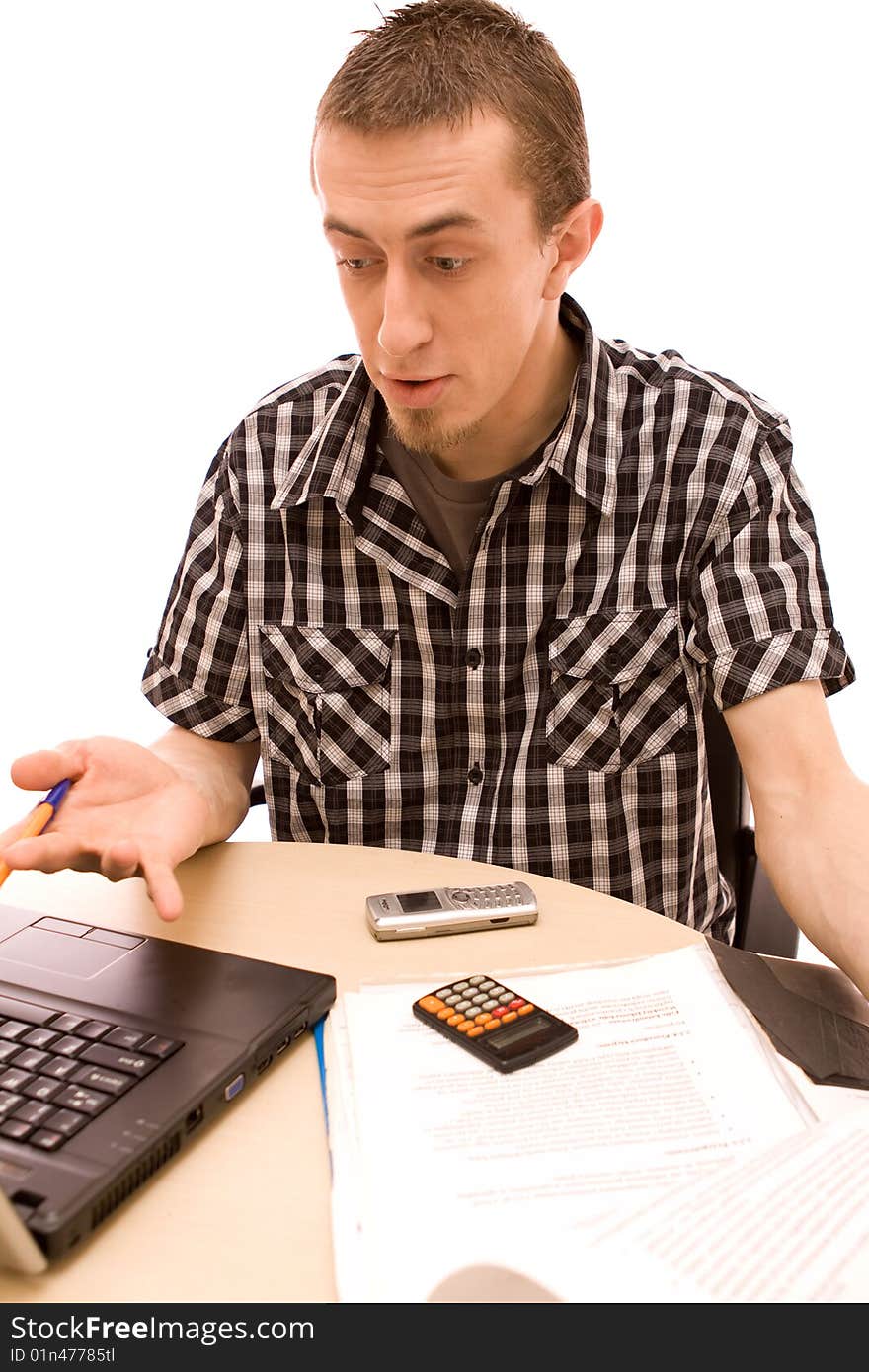 Man with phone working in office