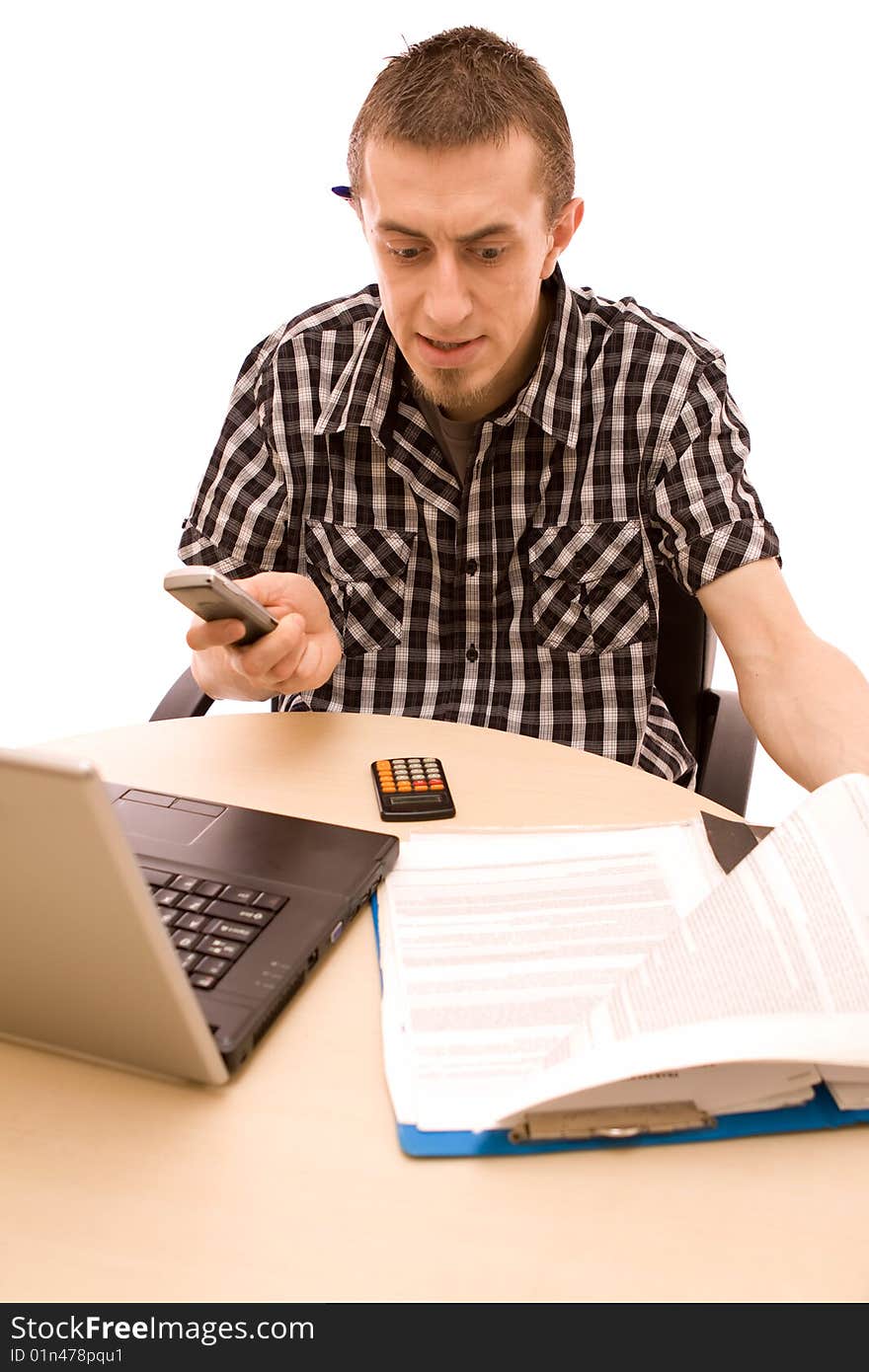 Man with phone working in office