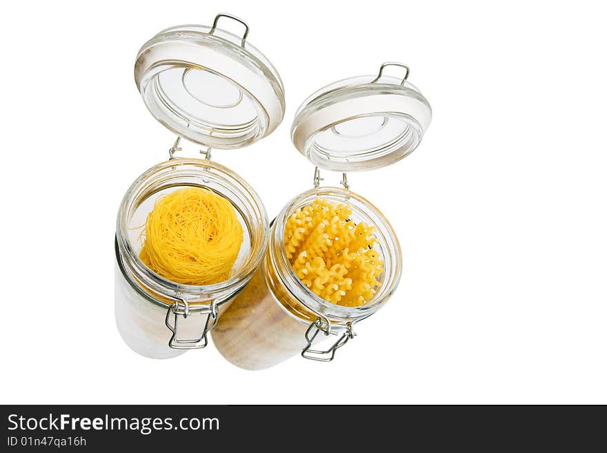 Pasta in glass can on a white background