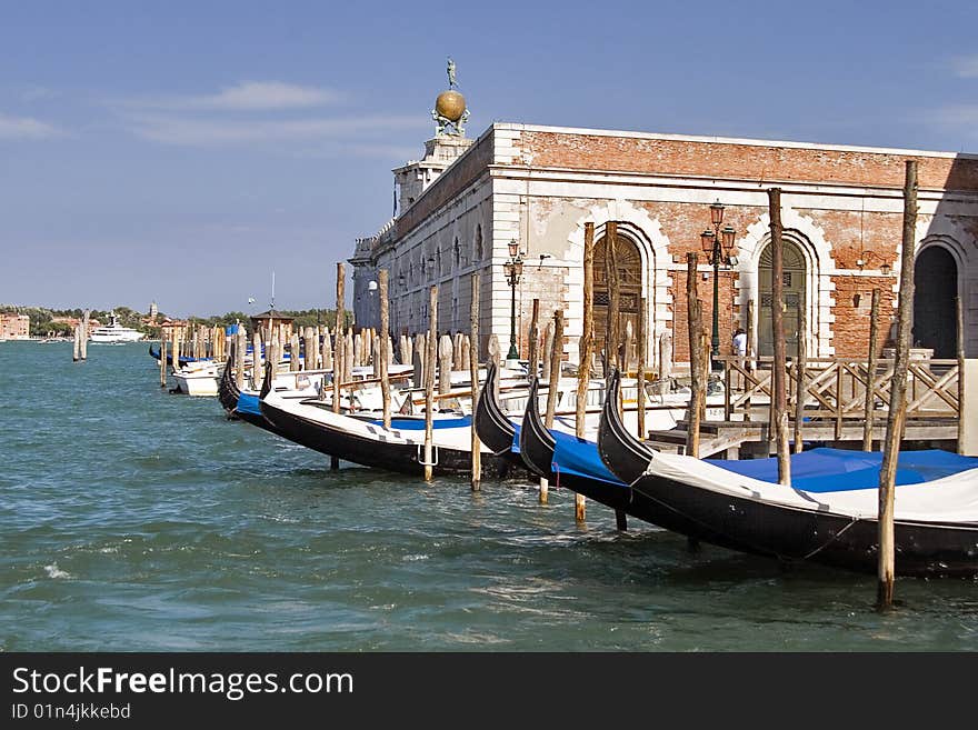 Water street with their boats and gondolas. Venice