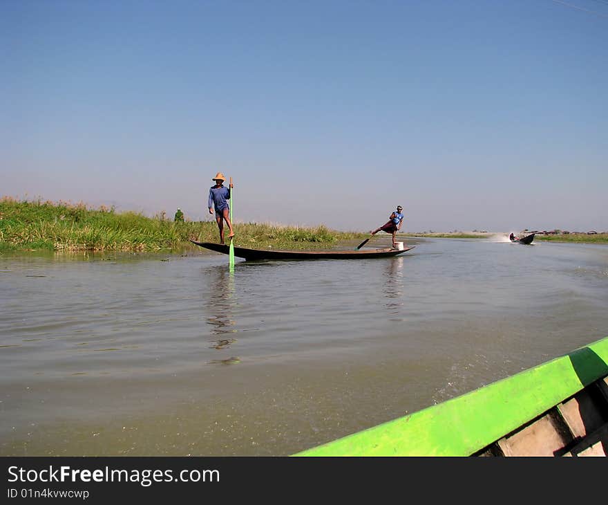 kayaking with legs in the lake under blue sky.