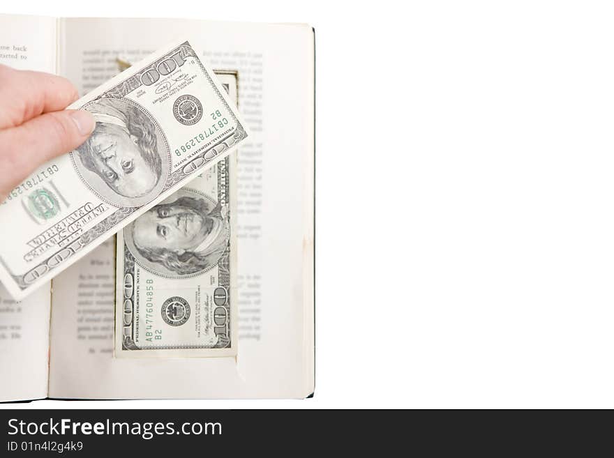 Hand Placing  One Hundred Dollar Bill in Prop Book. Hand Placing  One Hundred Dollar Bill in Prop Book