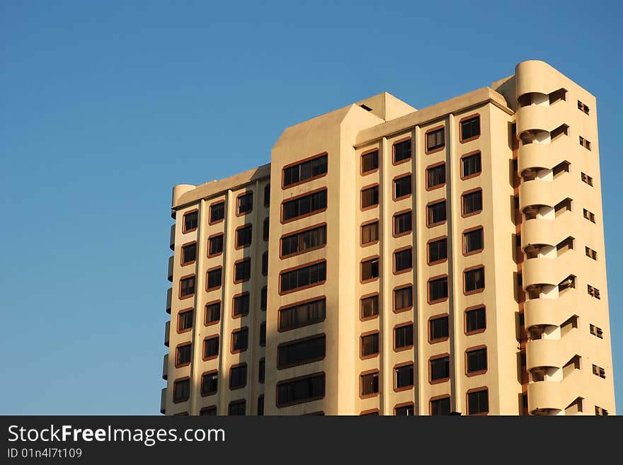 Old Apartment Building Against Blue Sky