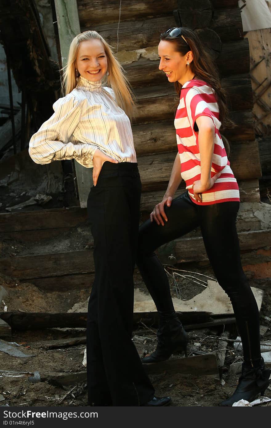 Two women posing in the backyard. Two women posing in the backyard