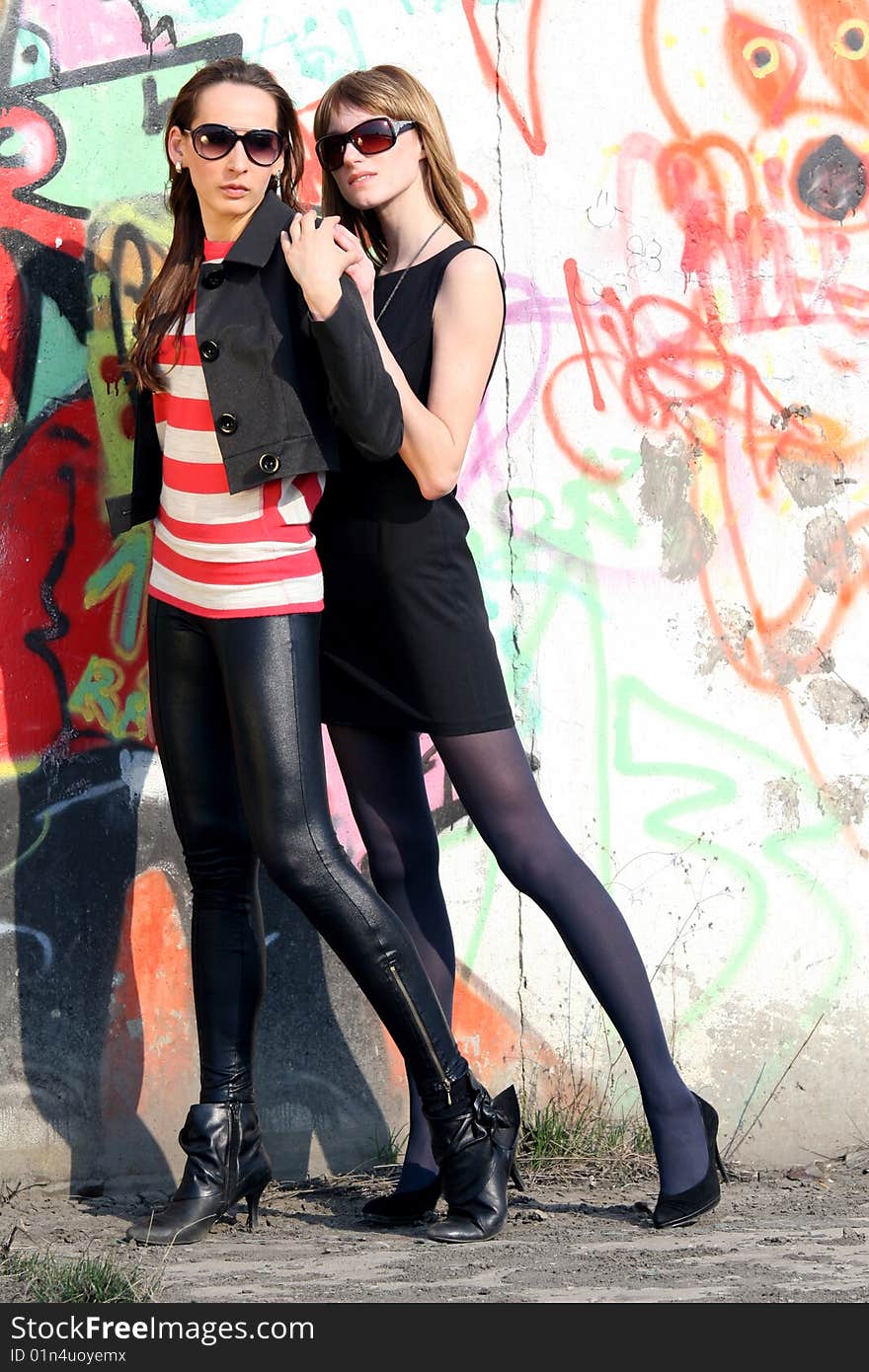 Women Posing At The Wall