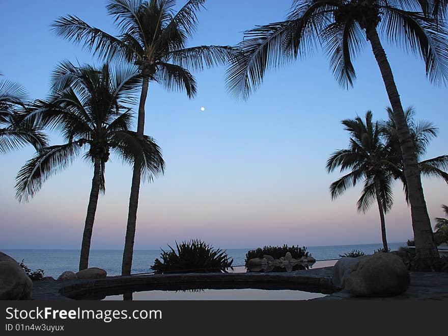 Sunset at pool in Palmilla Los Cabos, Baja California, Mexico. Sunset at pool in Palmilla Los Cabos, Baja California, Mexico