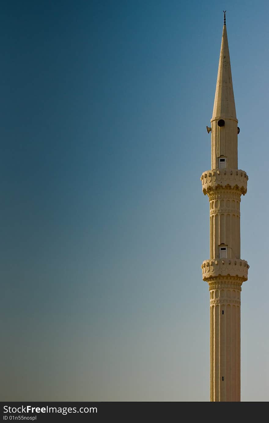 Minaret in Turkey, on the blue sky. Minaret in Turkey, on the blue sky