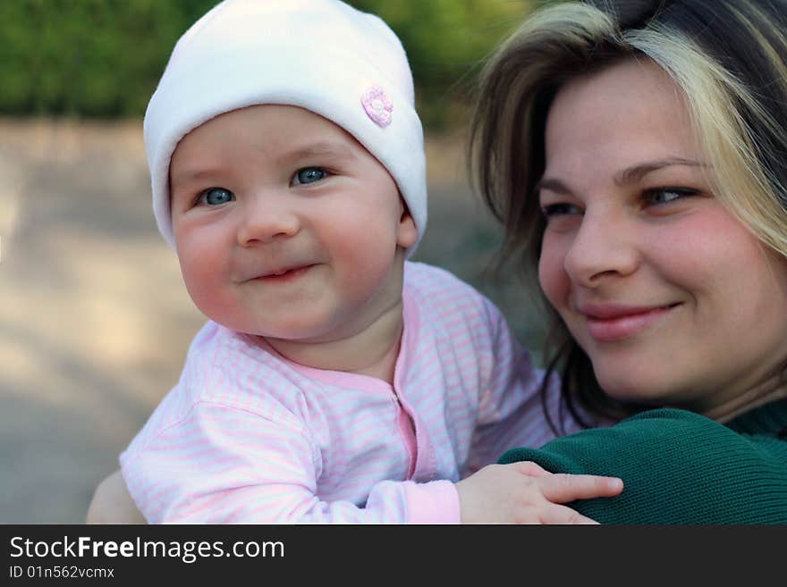 Portrait of happy mother and baby on the street. Portrait of happy mother and baby on the street