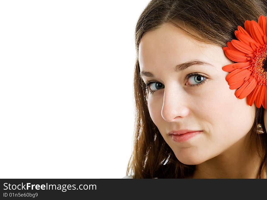 Beautiful woman with a bright red flower