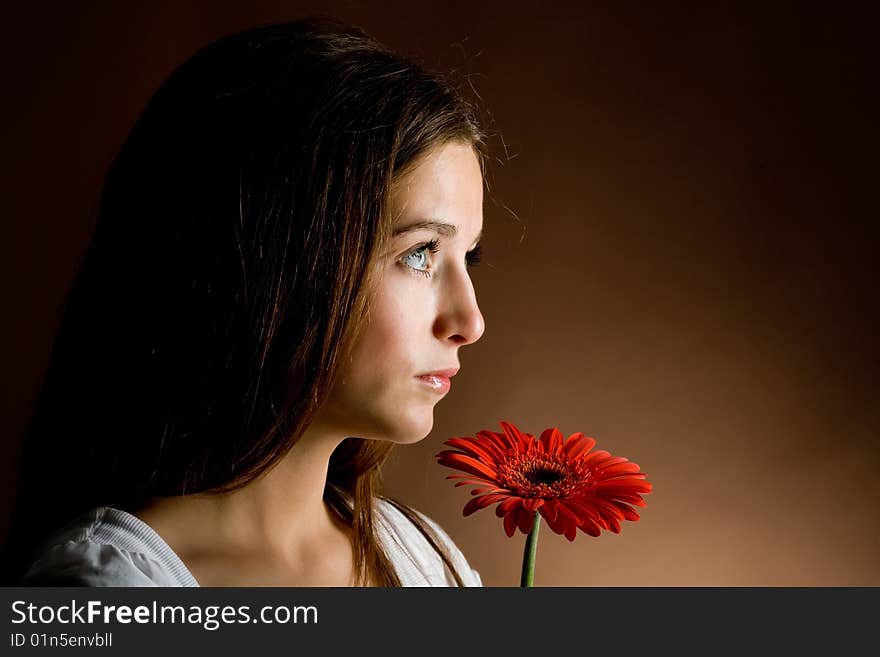 Young Woman With A Red Flower