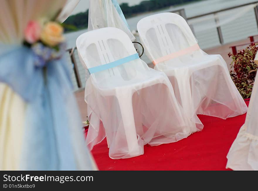 Chairs on stage for bride and groom. Chairs on stage for bride and groom