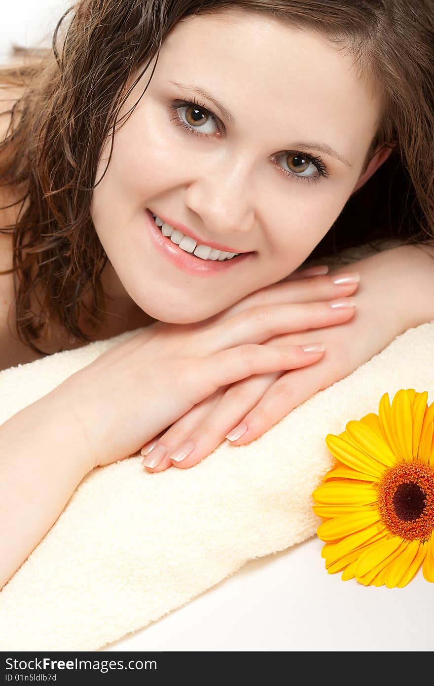 Smiling woman laying on the towel