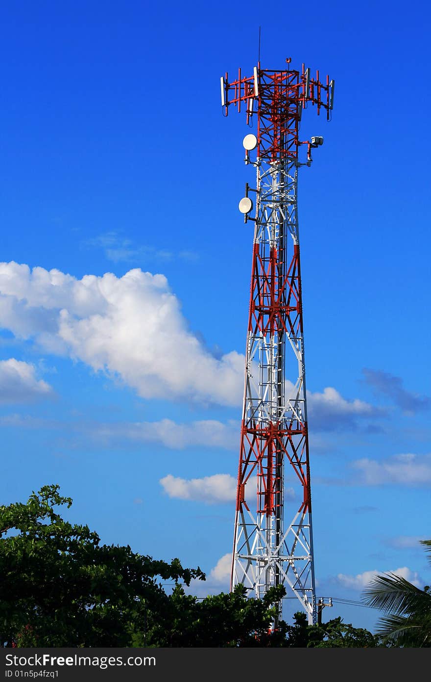 Cellular communication tower on a bright sunny day. Cellular communication tower on a bright sunny day